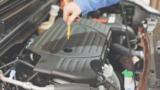 Draining engine oil during a service.